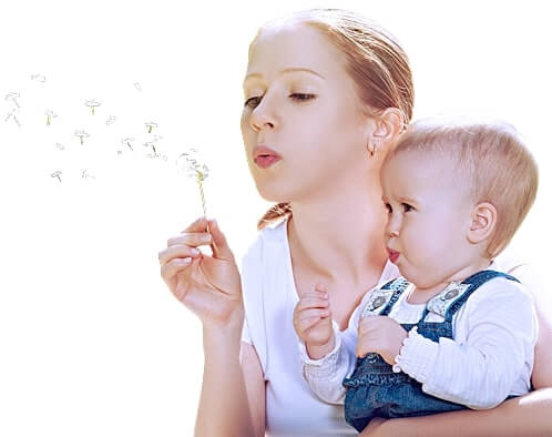Mother and son blowing bubbles